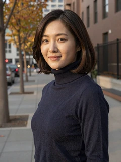 Korean woman in navy turtleneck on autumn city street using Sakuradate app